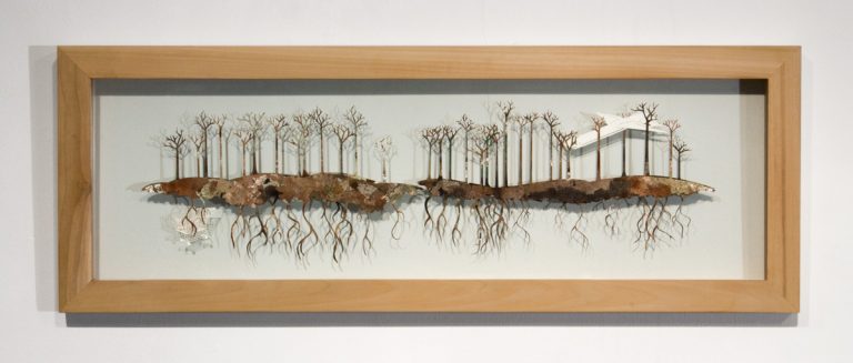 Image of plane in trees created with laser cut paper